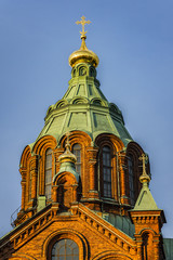 Fototapeta premium Uspenski cathedral (Uspenskin katedraali, 1862 - 1868), dedicated to Dormition of Theotokos (Virgin Mary). Sunset. Helsinki, Finland.