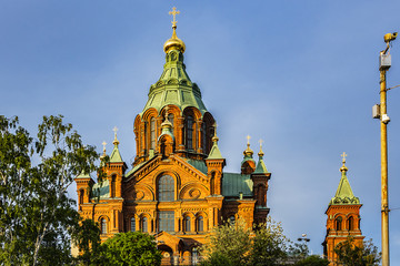 Fototapeta na wymiar Uspenski cathedral (Uspenskin katedraali, 1862 - 1868), dedicated to Dormition of Theotokos (Virgin Mary). Sunset. Helsinki, Finland.