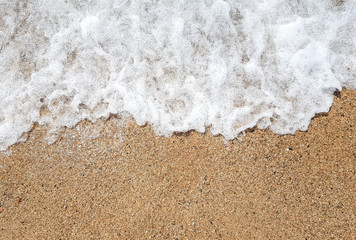 Ocean wave on sandy beach