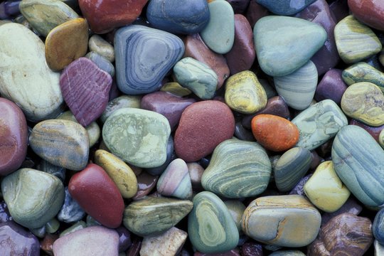 Colorful pebbles at the shore of McDonald Lake Glacier National Park Montana USA