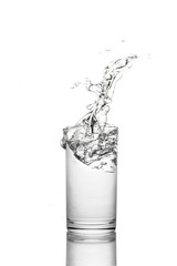 Water poured in  glass transparent white background