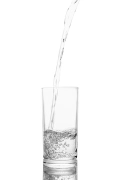Water poured in  glass transparent white background
