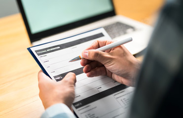 Survey, agreement or application paper. Man writing personal information to questionnaire, contract...