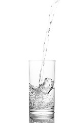 Water poured in  glass transparent white background