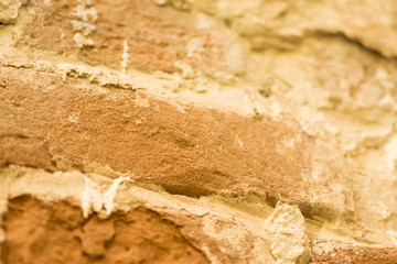An old brick wall. Red-orange texture, antique surface.