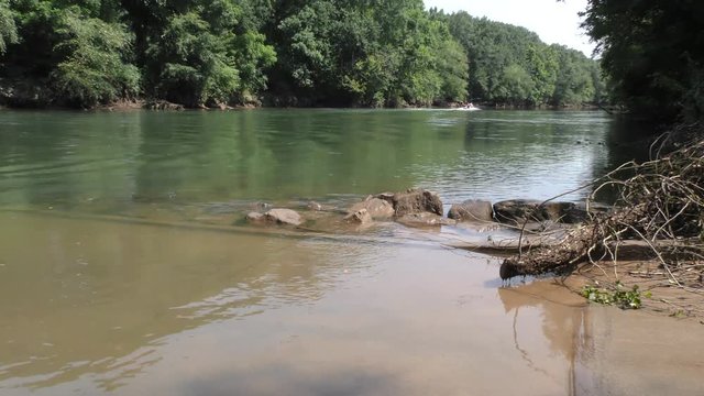 Georgia, Abbotts Bridge Park, A power boat going off into the distance on the Chattahoochee River