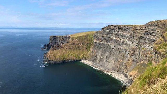 The famous Cliffs of Moher are sea cliffs located at the southwestern edge of the Burren region in County Clare, Ireland. They run for about 14 kilometres.