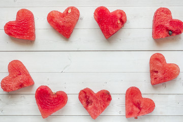 Obraz na płótnie Canvas Hearts carved out of watermelon. Concept of Valentine's day Copy space
