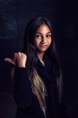 Girl posing and showing thumb up