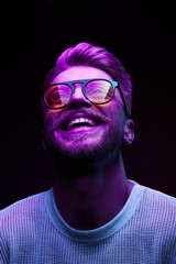Neon portrait of smiling man model with mustaches and beard in orange sunglasses and white t-shirt - 216136756
