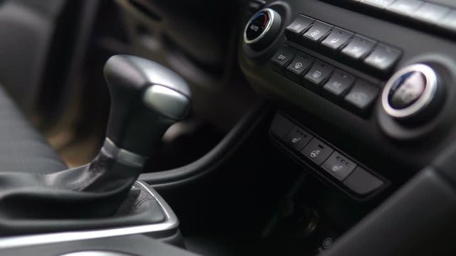 footage of a vehicle gear lever, modern car inerior