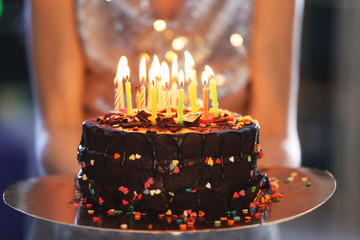Young woman with birthday cake, closeup - Powered by Adobe