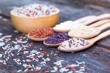 Five kinds of organic rice on wooden floor