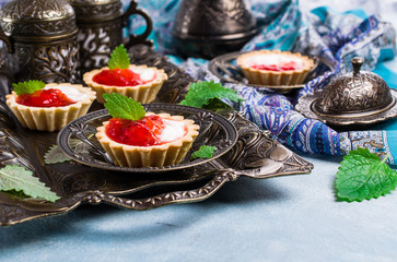 Round tartlets with red jam