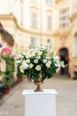 Beautiful flower decorations for the wedding ceremony. White roses