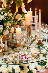 Sparkling glassware stands on table prepared for elegant wedding
