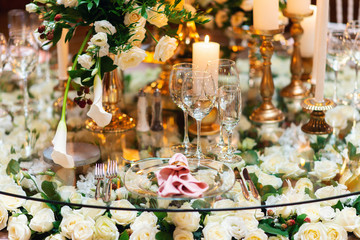 Sparkling glassware stands on table prepared for elegant wedding
