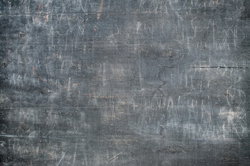 dark greay wooden board with scratches