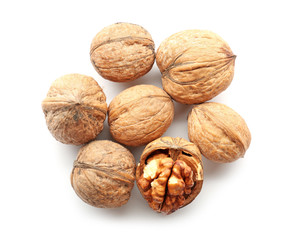 Tasty walnuts on white background