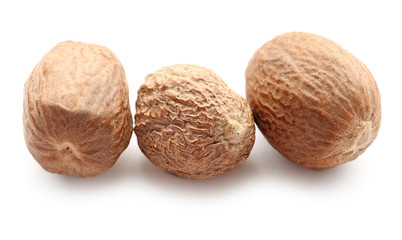 Nutmegs on white background