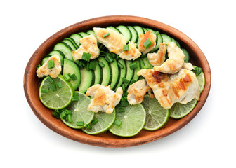 Salad with ripe avocado, chicken and lime on white background