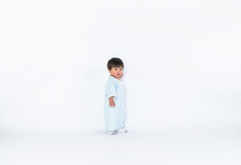 Infant child baby girl kid toddler in diaper make first steps isolated on a white background
