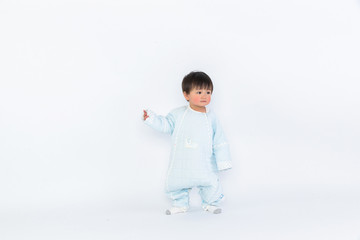 Infant child baby girl kid toddler in diaper make first steps isolated on a white background