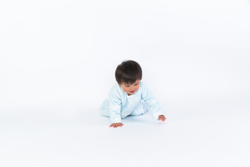 cute cheerful crawling baby boy isolated on white background