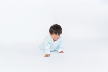 cute cheerful crawling baby boy isolated on white background