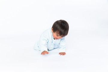 cute cheerful crawling baby boy isolated on white background