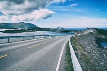 Photo sur Plexiglas Atlantic Ocean Road The Atlantic Ocean Road -  Atlanterhavsveien  8.3-kilometer  long section of County Road 64 runs through an archipelago in Eide and Averoy in More og Romsdal, Norway