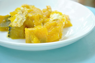 stir fried pumpkin with egg on plate