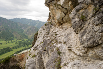 View from the top of the Altai mountains in Siberia with green plants and trees
