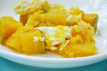 stir fried pumpkin with egg on plate