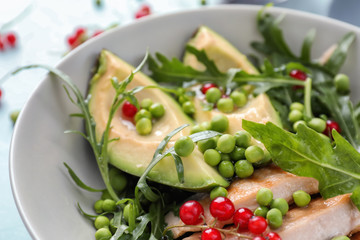 Tasty grilled chicken fillet and vegetables in bowl, closeup