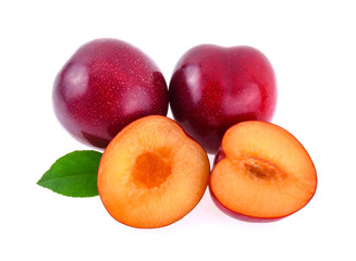 red cherry plum with green leaves isolated on white background