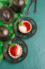 Round tartlets with red jam
