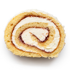 Fototapeta premium Slice of coconut swiss roll with cream and jam isolated on white from above.