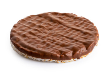 Whole chocolate rice cake isolated on white.