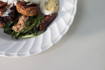 The food combination in the white dish easy for eat on white table.