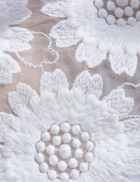 Detail of white lace flower design