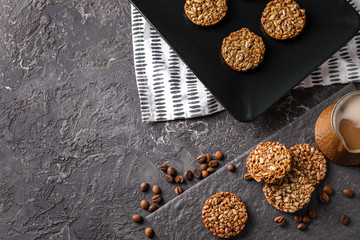 Tasty brittles and jezve with aromatic coffee on table
