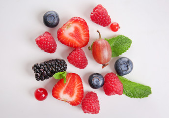 Different ripe berries on white background