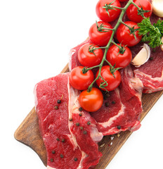 Fresh raw meat with spices and vegetables on white background