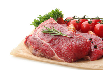 Fresh raw meat with spices, herbs tomatoes on white background