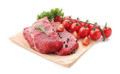 Fresh raw meat with spices, herbs tomatoes on white background