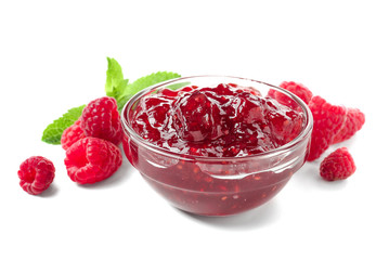 Bowl with raspberry jam on white background