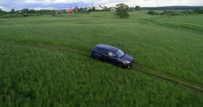 The car is driving up the hill