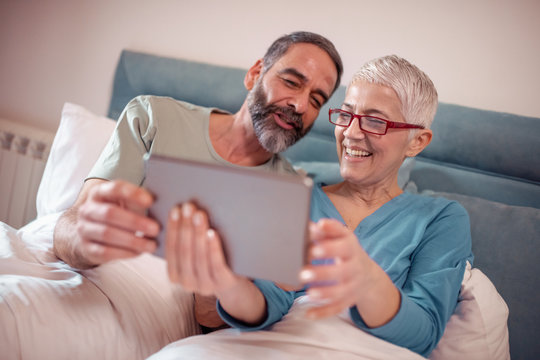 Mature couple using tablet