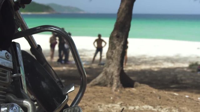 Motorcycle paking on sea beach background. Motorbike standing on parking and bikers resting on sea beach.